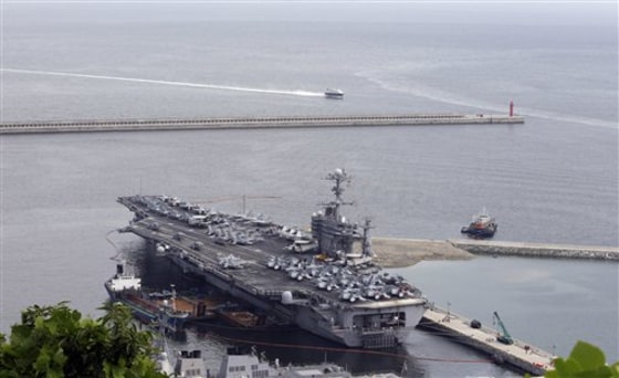 The U.S. nuclear-powered aircraft carrier USS George Washington drops anchor in Busan, south of Seoul, South Korea, on Saturday.